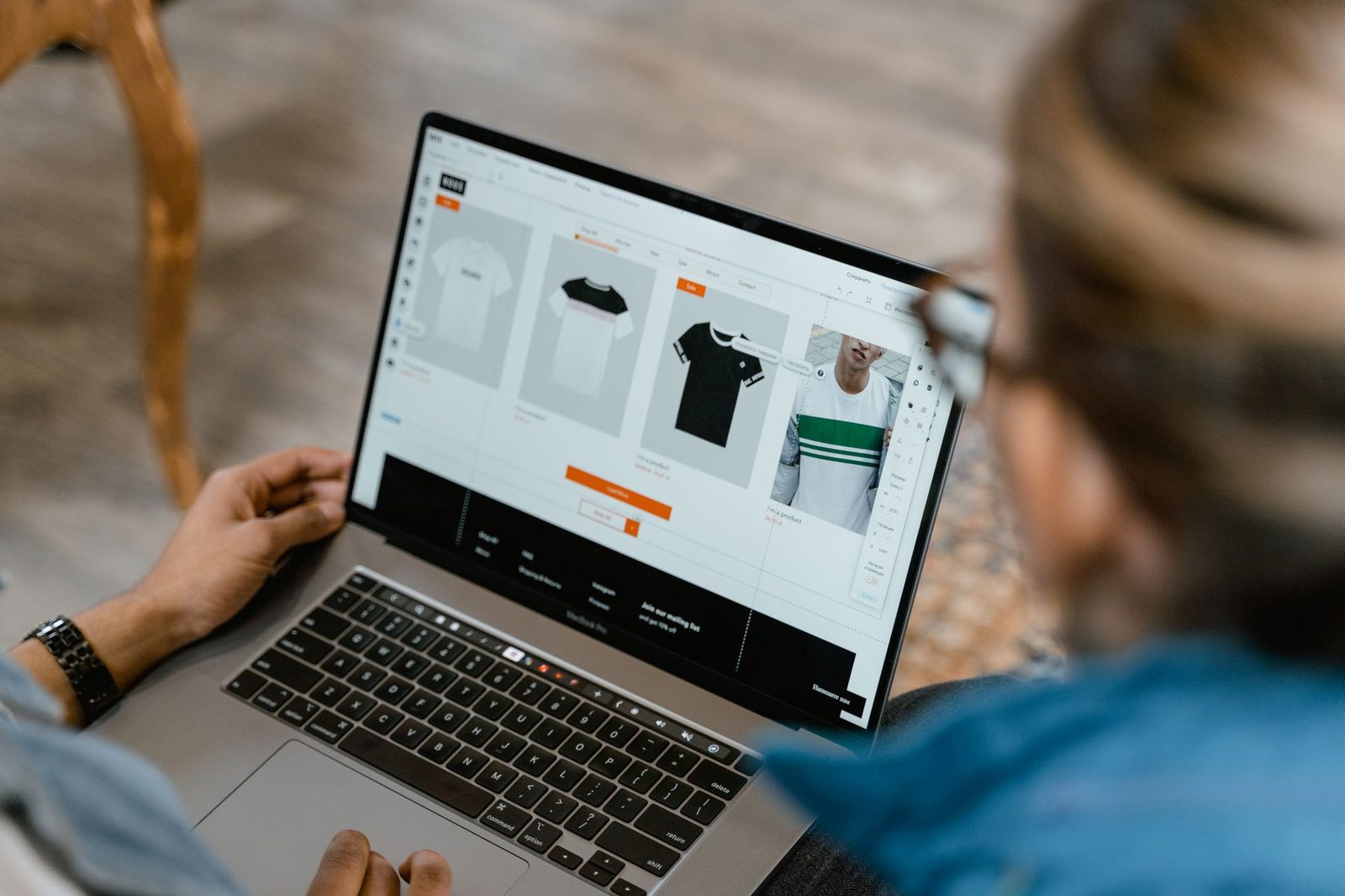 Merchant building a product page for an online store on a laptop
